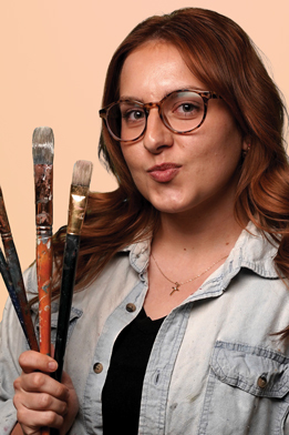 syd2-Web portrait photo of SYDNEY HEBERT Graphic Designer of burning stick creative alternate